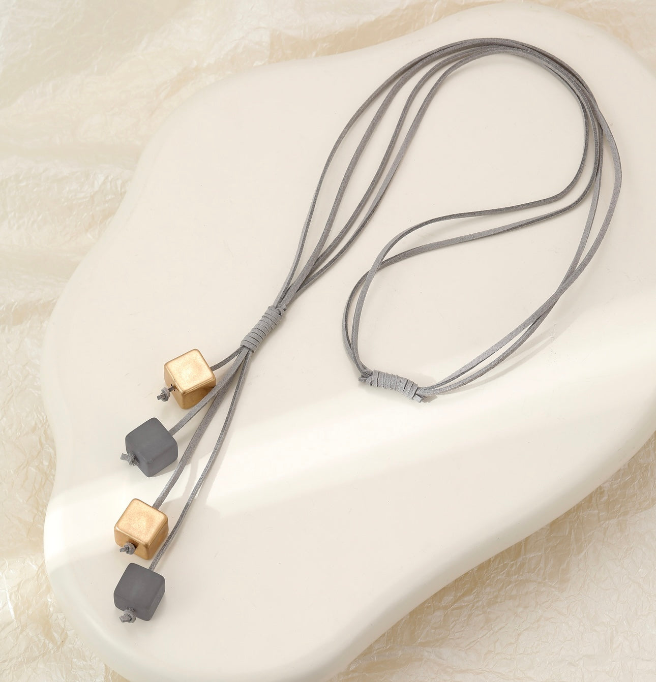 Long leather and gold and grey resin cube statement neckpiece