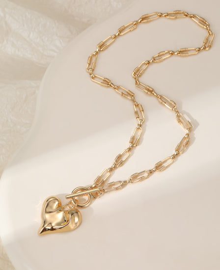 Gold plated heart on anchor chain