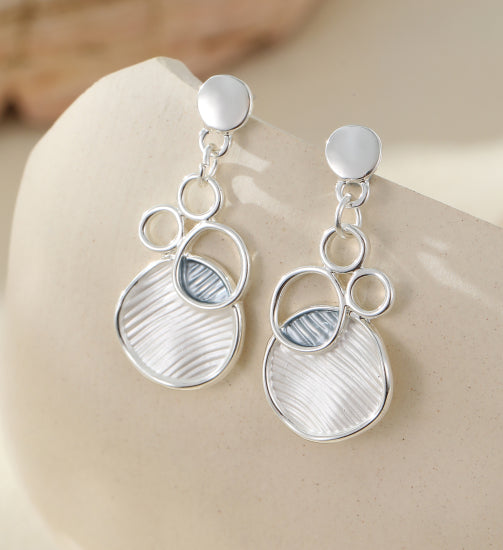 Contemporary interlinked silver alloy drop earrings