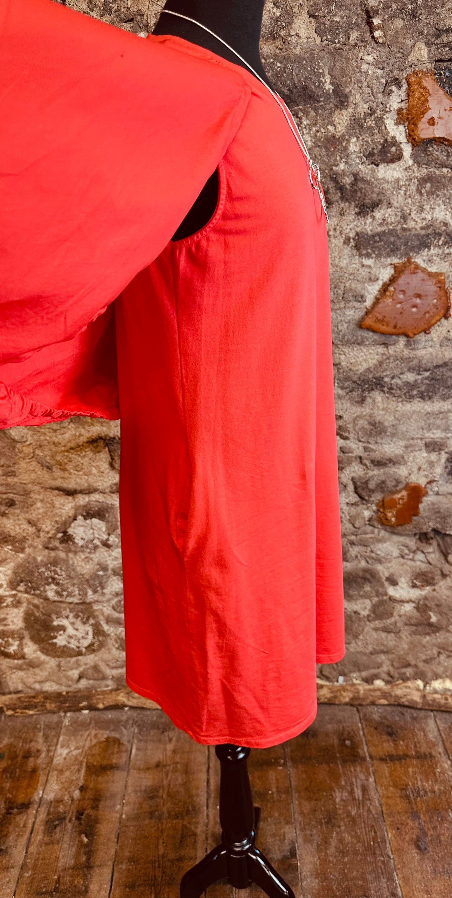 “Nancy “ contemporary coral Italian jersey and cotton caped dress