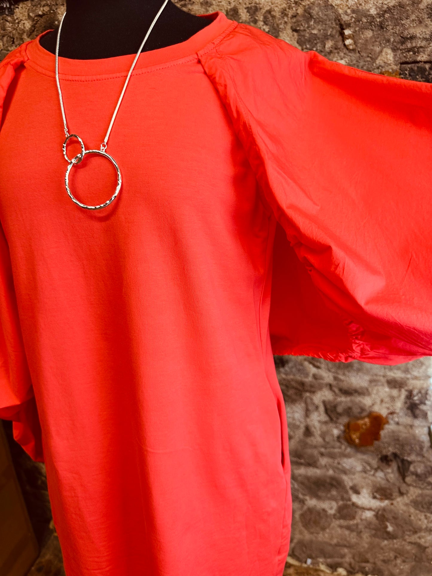 “Nancy “ contemporary coral Italian jersey and cotton caped dress