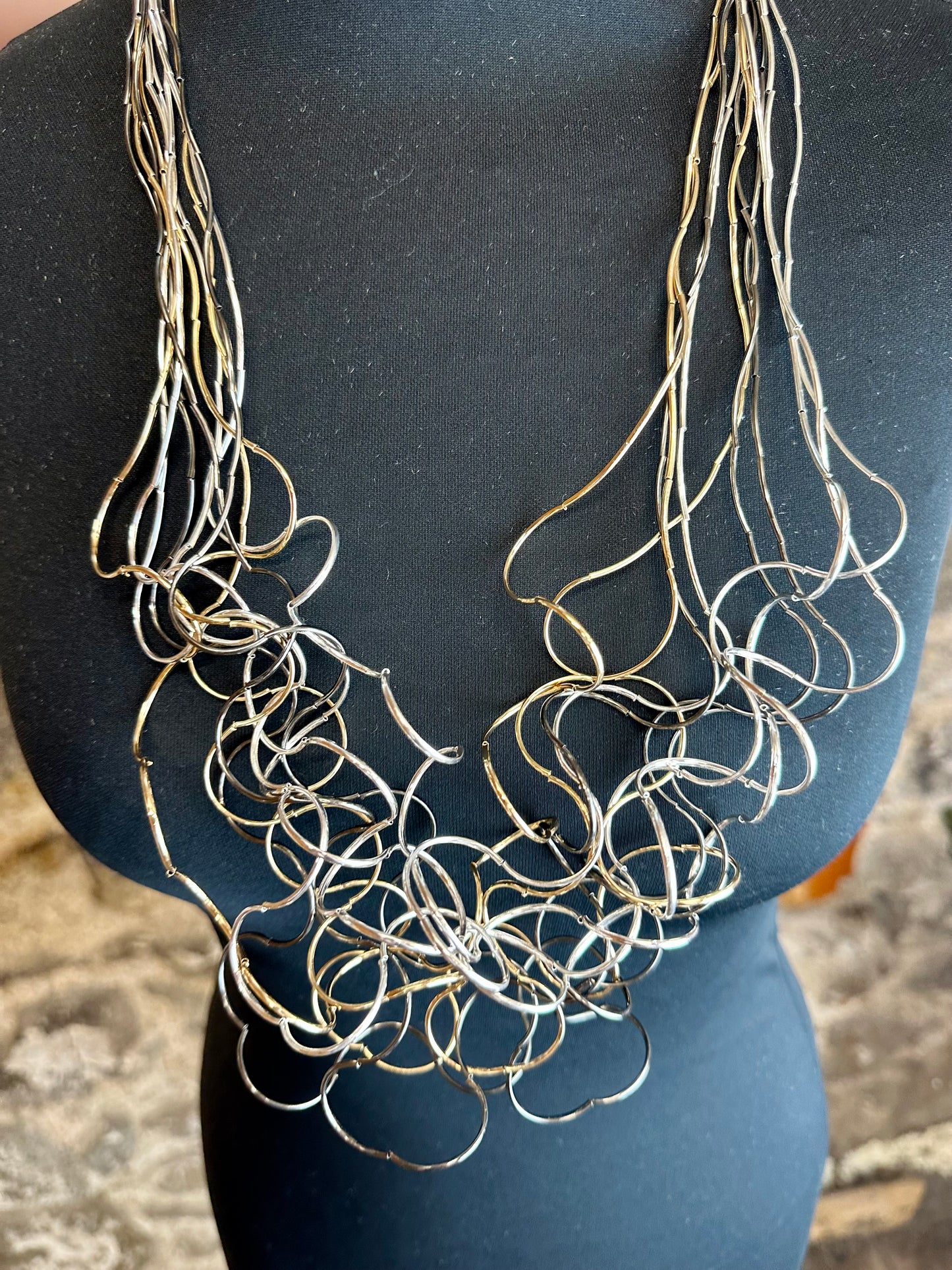 Lorsha 3 colour link statement curly neckpiece..silver graphite..gold long