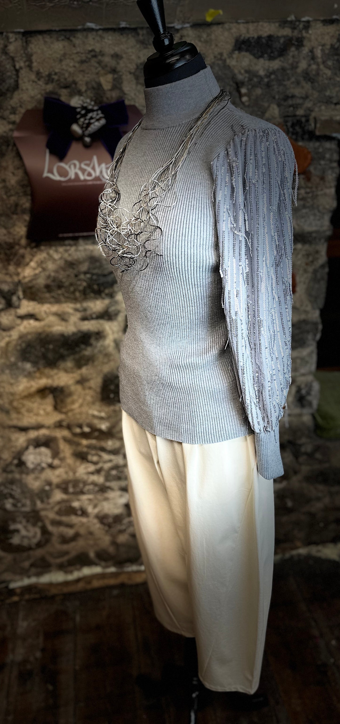 “Georgina “ dove grey dramatic sparkling knit sleeve