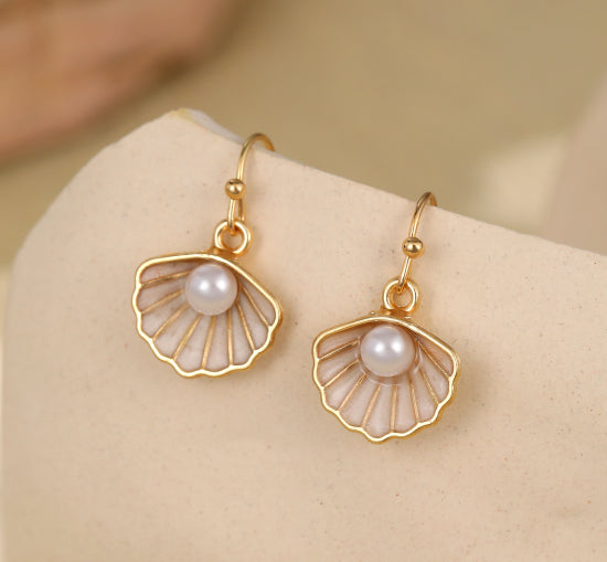 Delicate shell gold plated earrings with pearl inset