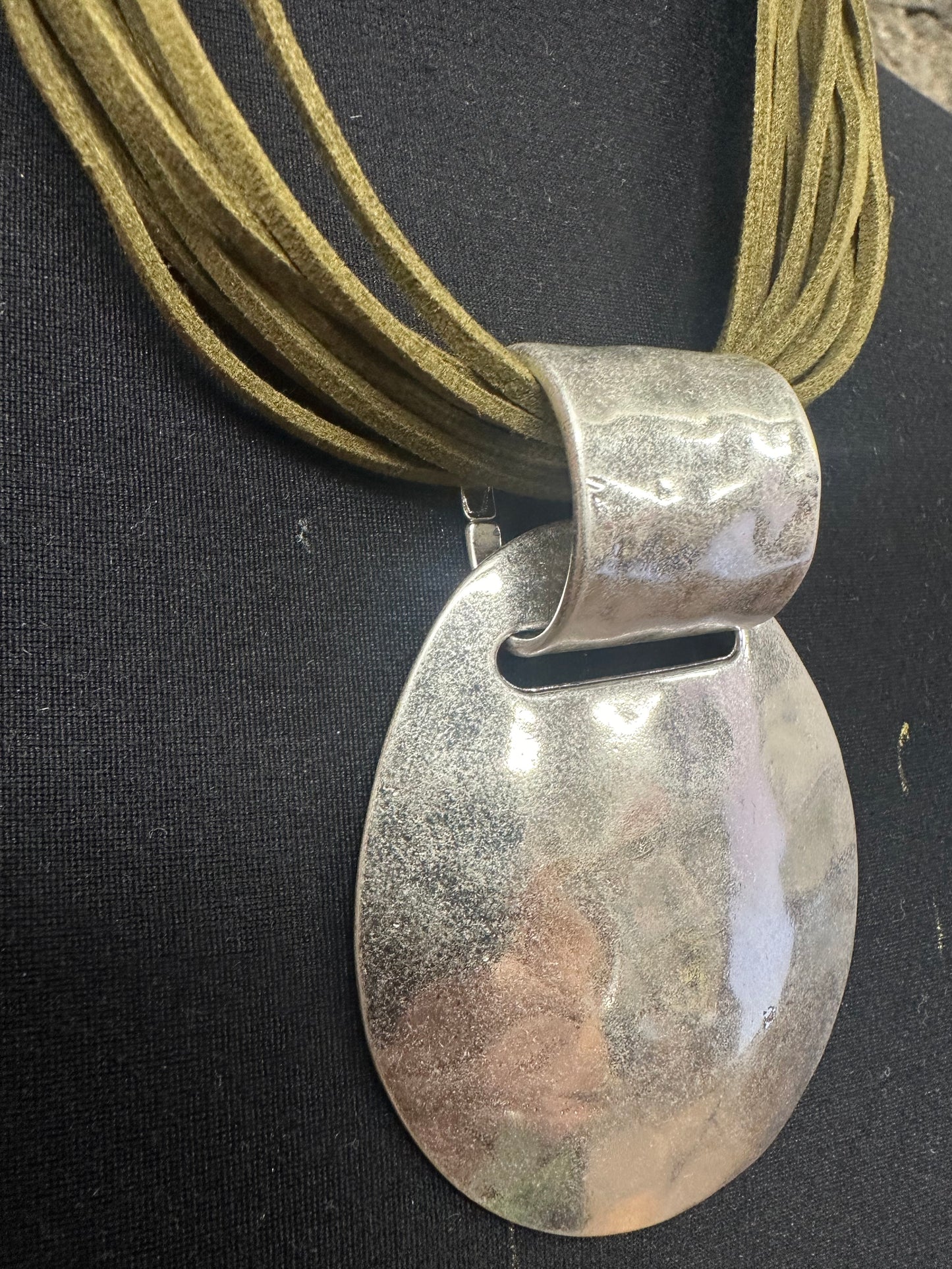 Statement brushed silver metal neckpiece with soft suede olive green collar